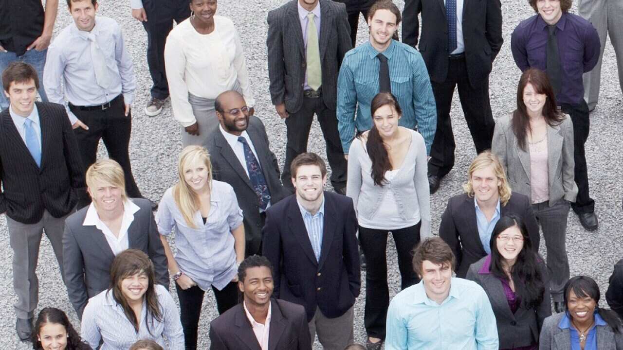 Portrait of business people in crowd
