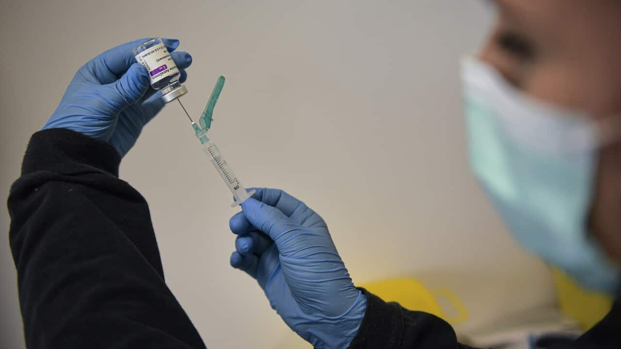 A health worker prepares a dose of the AstraZeneca vaccine in Pamplona, Spain.