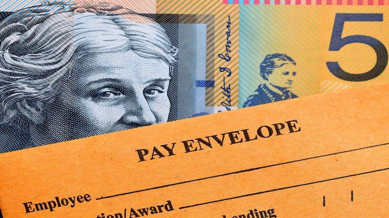 A stock image of Australian currency and a wages envelope.