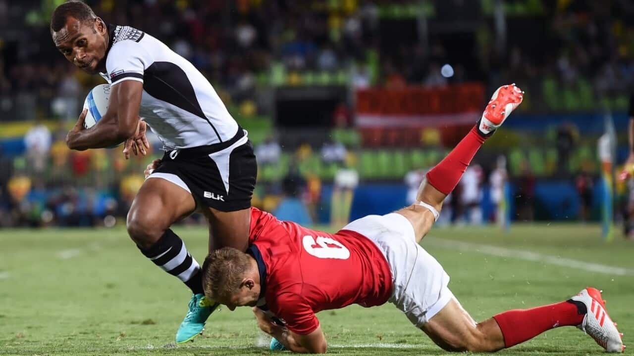 Fijian player in action in the gold medal match against England