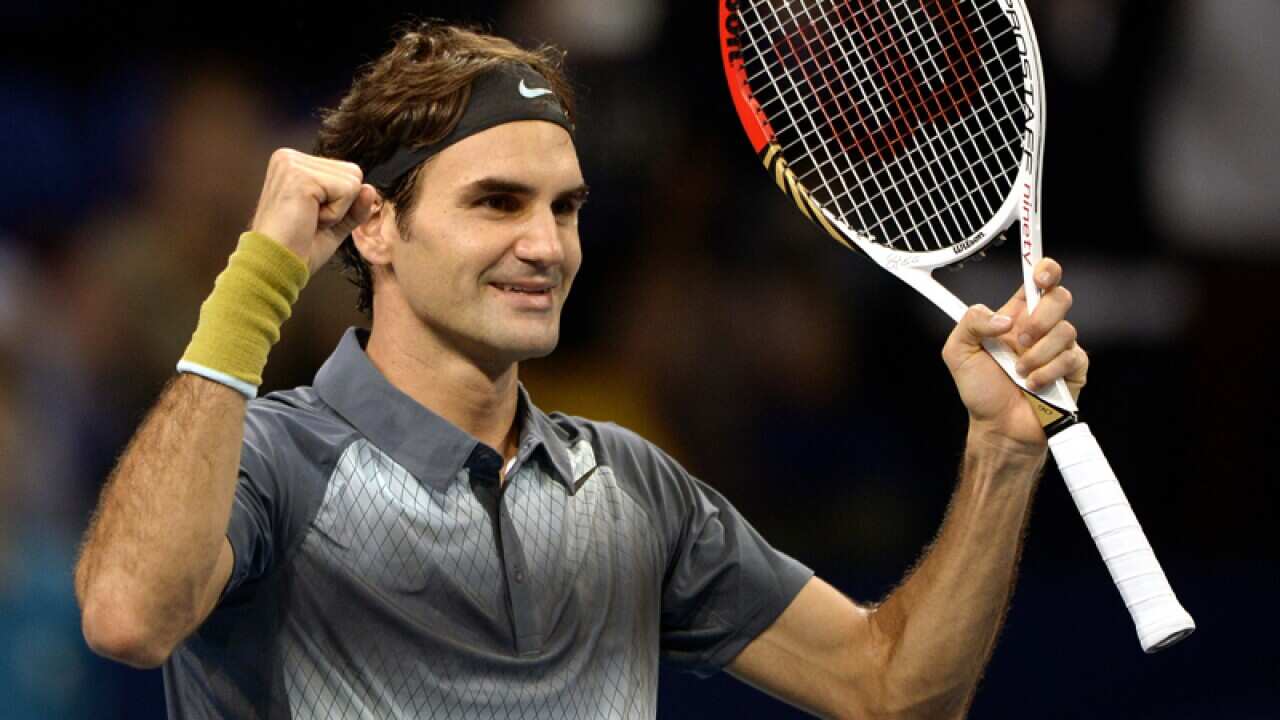 Roger Federer celebrates after defeating Vasek Pospisil