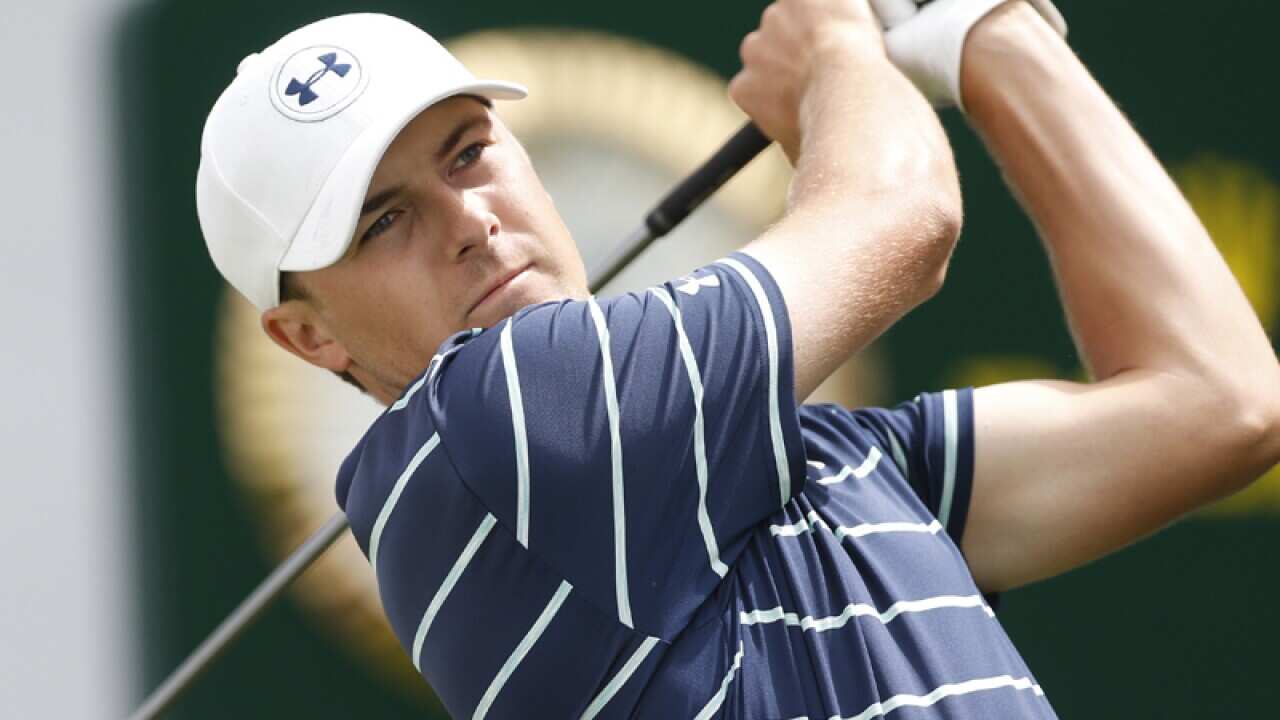Jordan Spieth tees off on the first hole