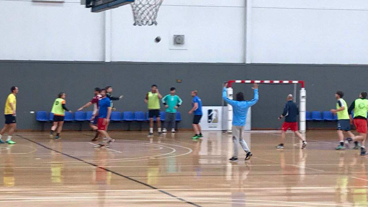 Australian handball coach with his team training