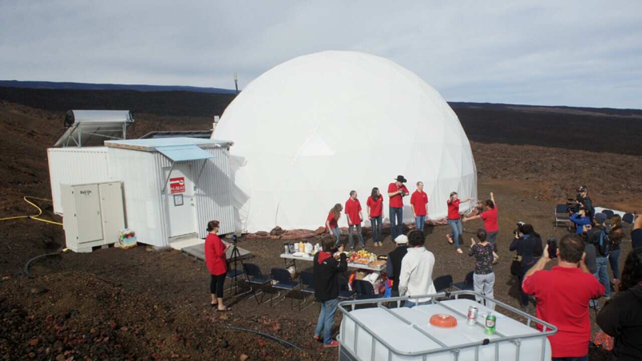 Six scientists exit the dome.