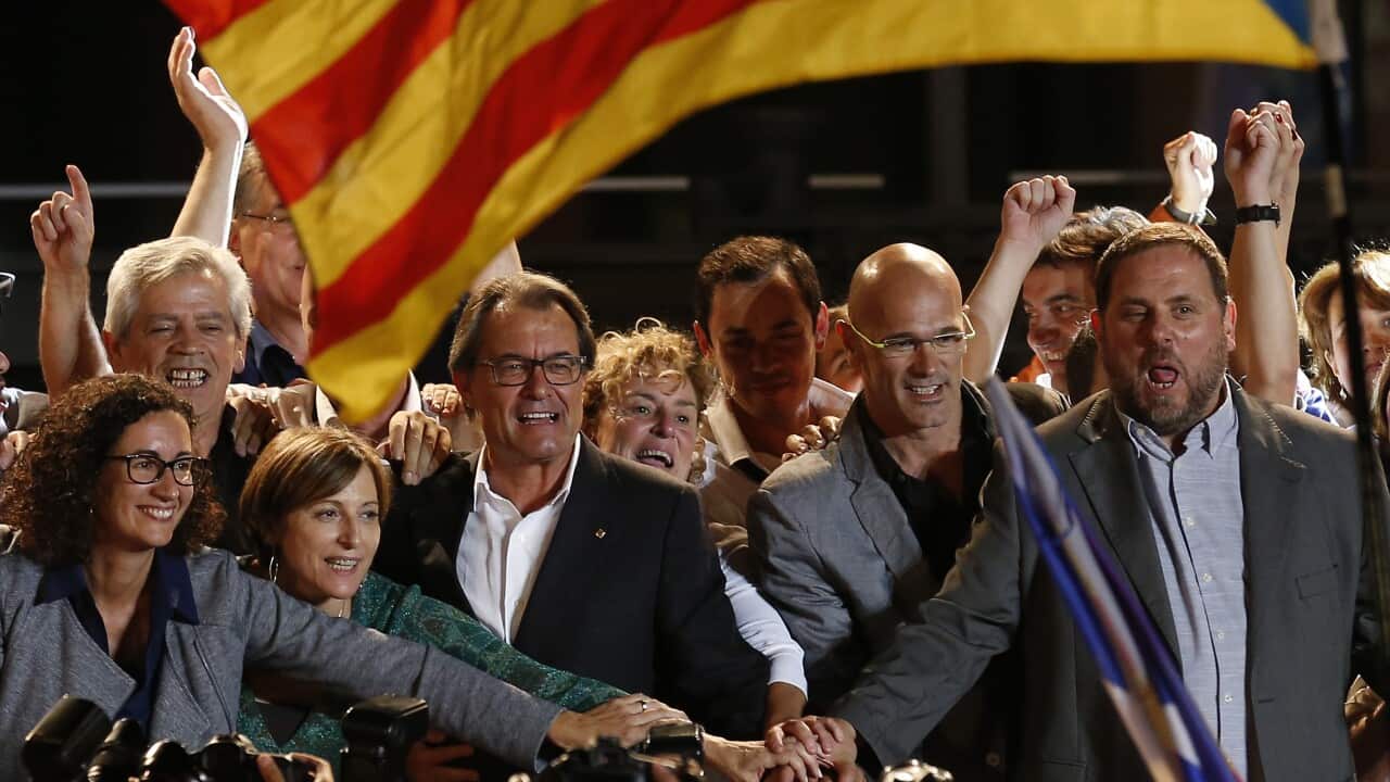 The President of Democratic Convergence of Catalonia Artur Mas, center, next to the president of the Esquerra Republicana de Catalunya Oriol Junqueras, right, and the leader of the Catalan party "Junts pel si" 