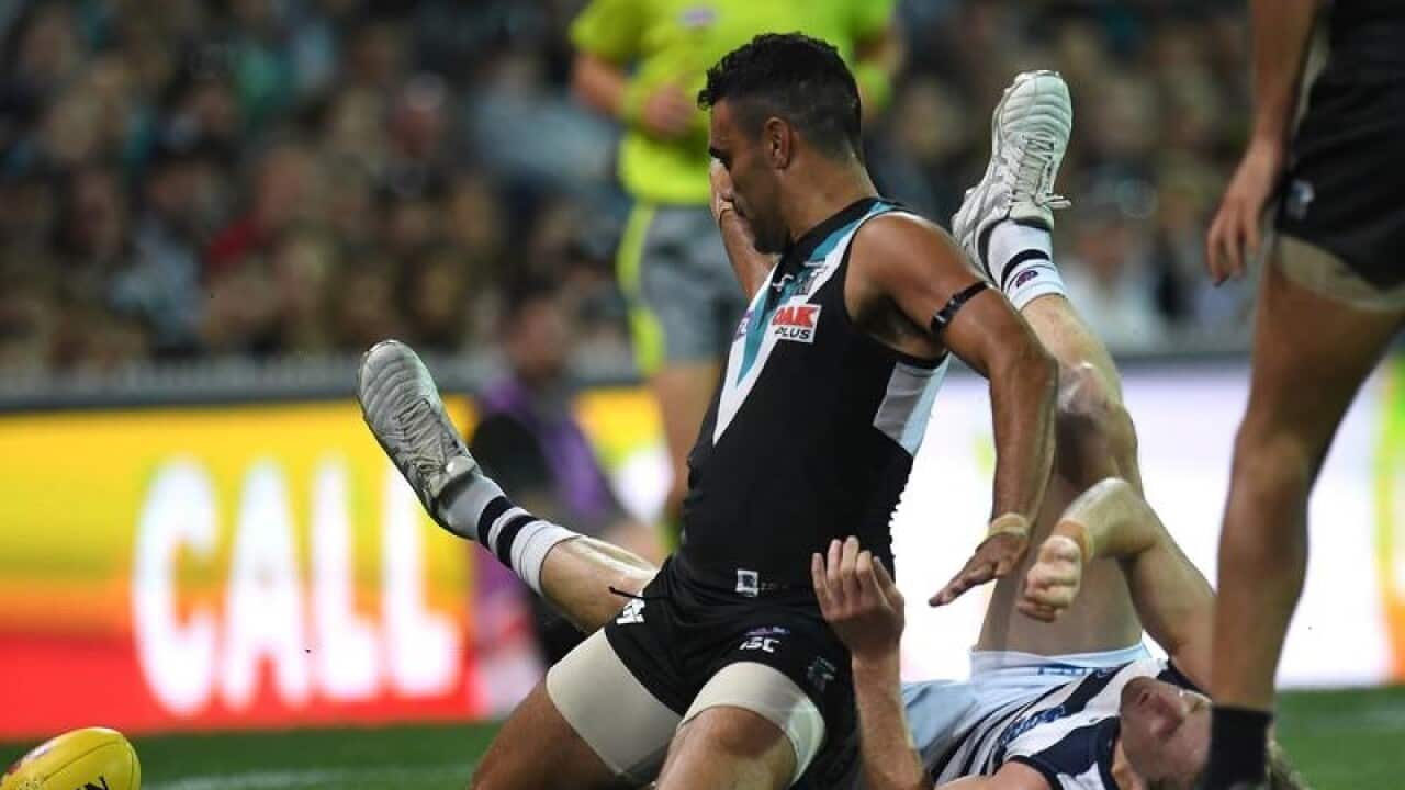 Lindsay Thomas of the Power (left) and Scott Selwood clash.