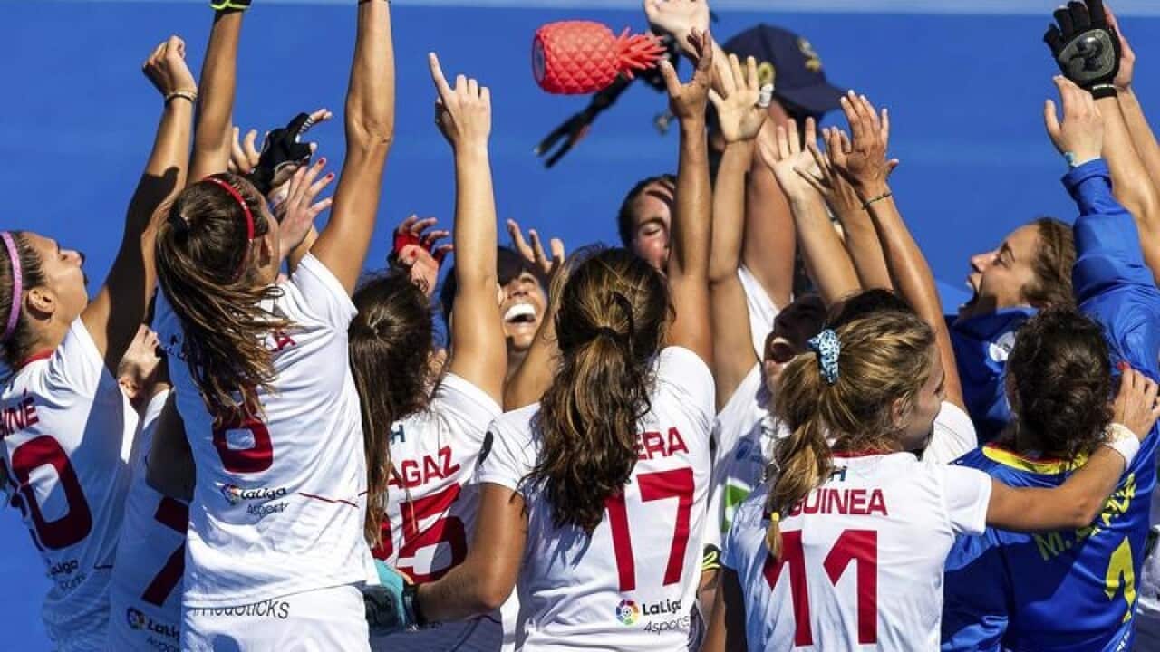 Spanish women field hockey players celebrating