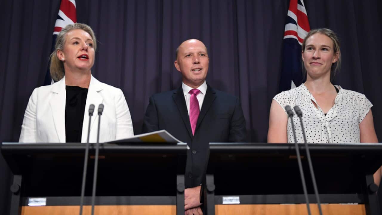 Minister for Sport Bridget McKenzie, Minister for Home Affairs Peter Dutton and gold medallist Kim Brennan