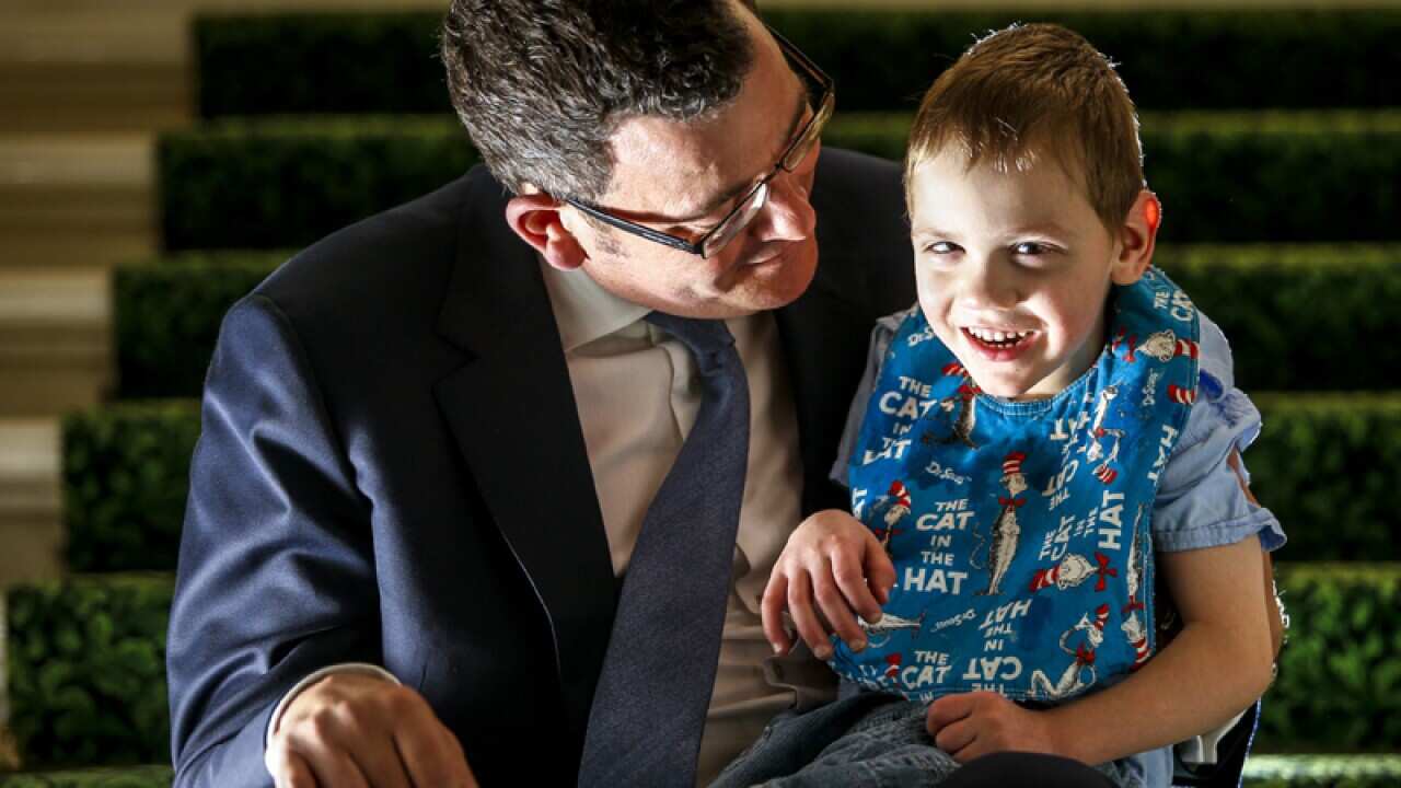Victorian Premier Daniel Andrews with epilepsy sufferer Cooper Wallace