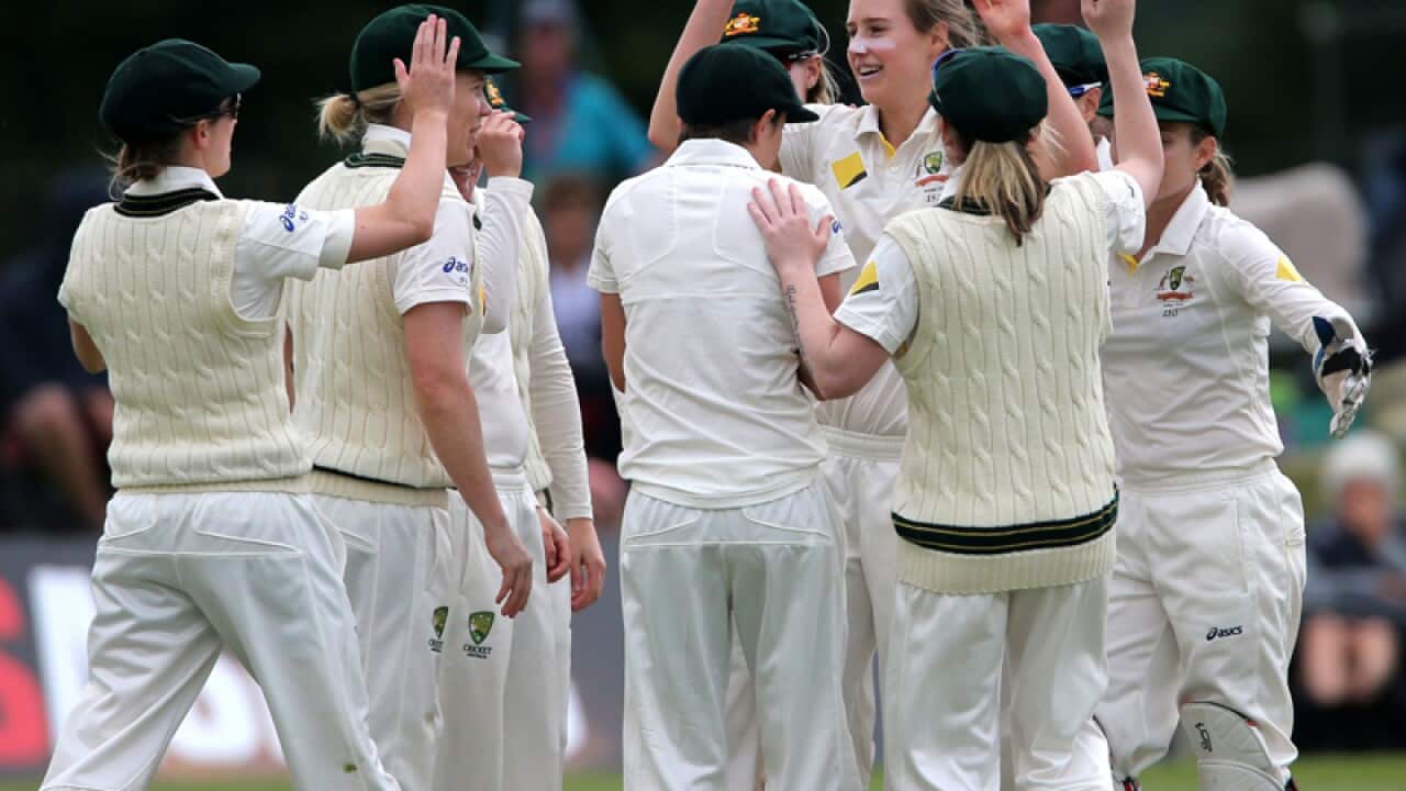 The Australian women's cricket team celebrate a wicket