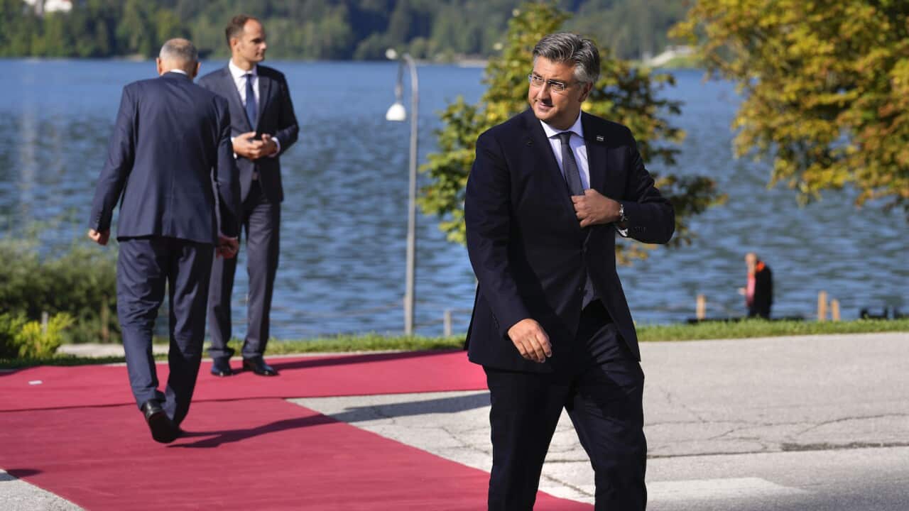 Croatia's Prime Minister Andrej Plenkovic, right, arrives for a meeting of the Bled Strategic Forum at the Bled Festival Hall in Bled, Slovenia, Wednesday, Sept. 1, 2021.