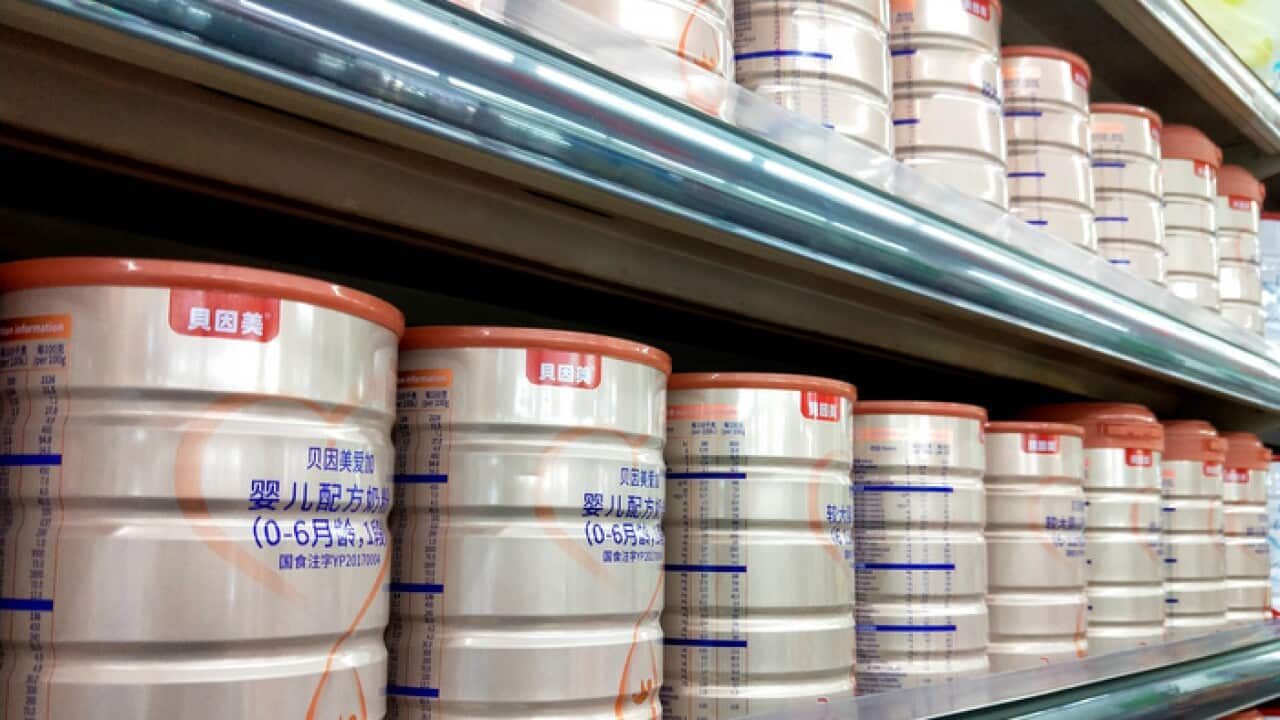 View of tins of Beingmate infant formula for sale China's Yunnan province