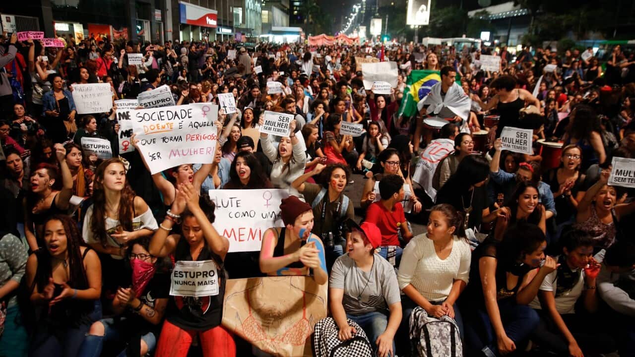 Women protest against the gang rape of a 16-year-old girl in Sao Paulo, Brazil, Wednesday, June 1, 2016.
