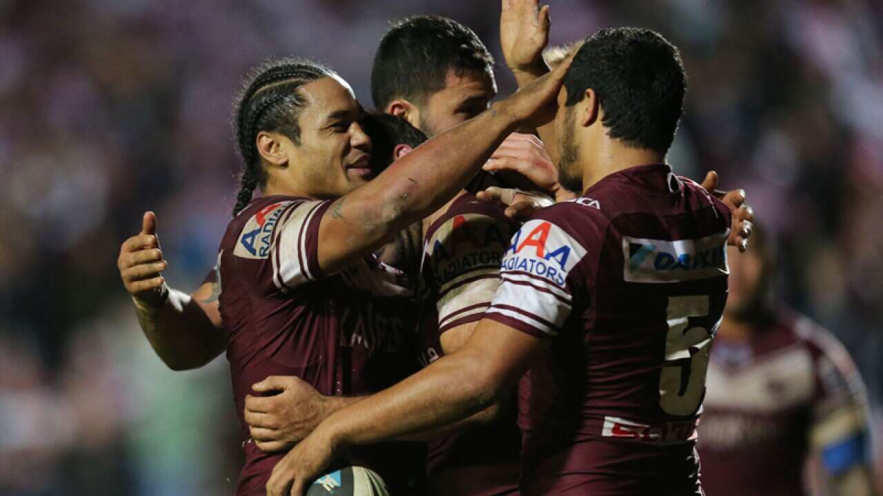 Manly celebrate during the round 16 NRL match