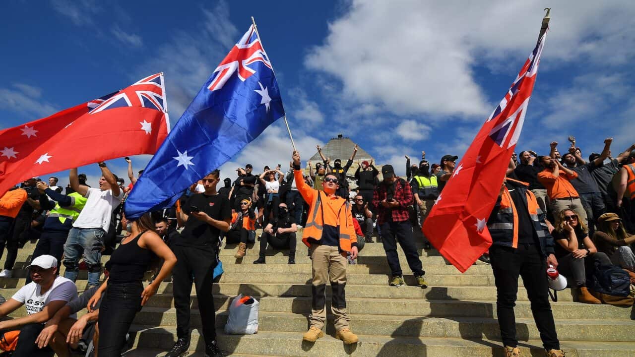 Protesters are seen at a demonstration against mandatory Covid-19 vaccinations and a two week shutdown of the construction industry at the Shrine of Remembrance in Melbourne, Wednesday, September 22, 2021.  (AAP Image/James Ross) NO ARCHIVING