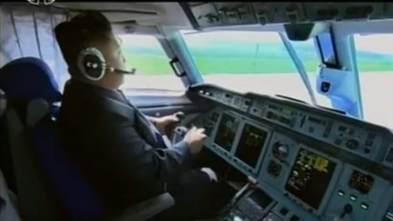 A still from the video showing Kim Jong Un piloting a plane (YouTube)