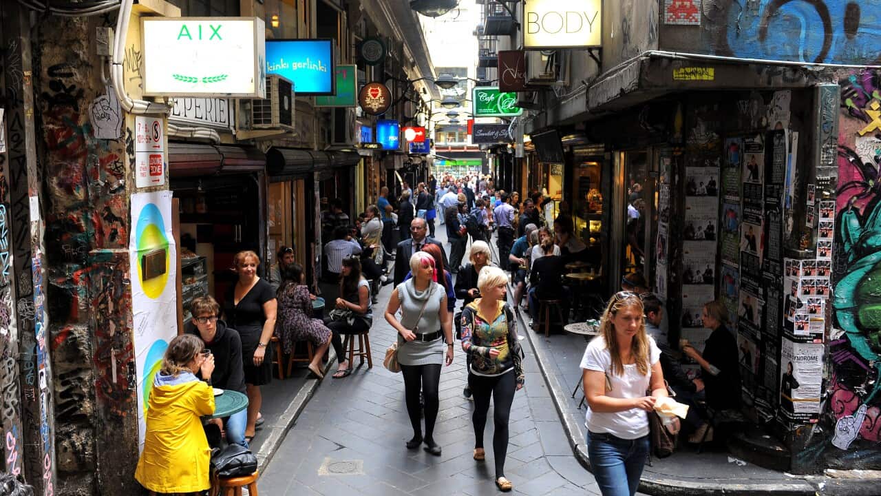 People walk through laneways in inner-ci