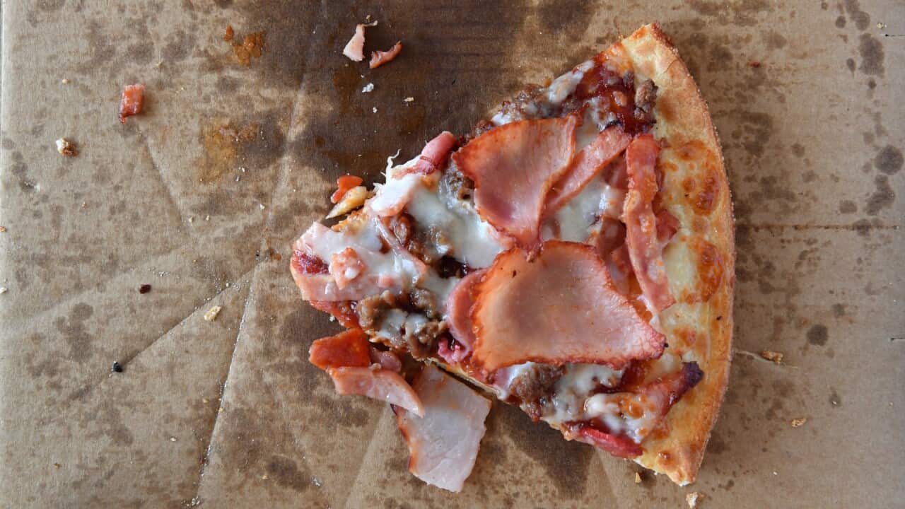 A single slice of a meatlovers pizza