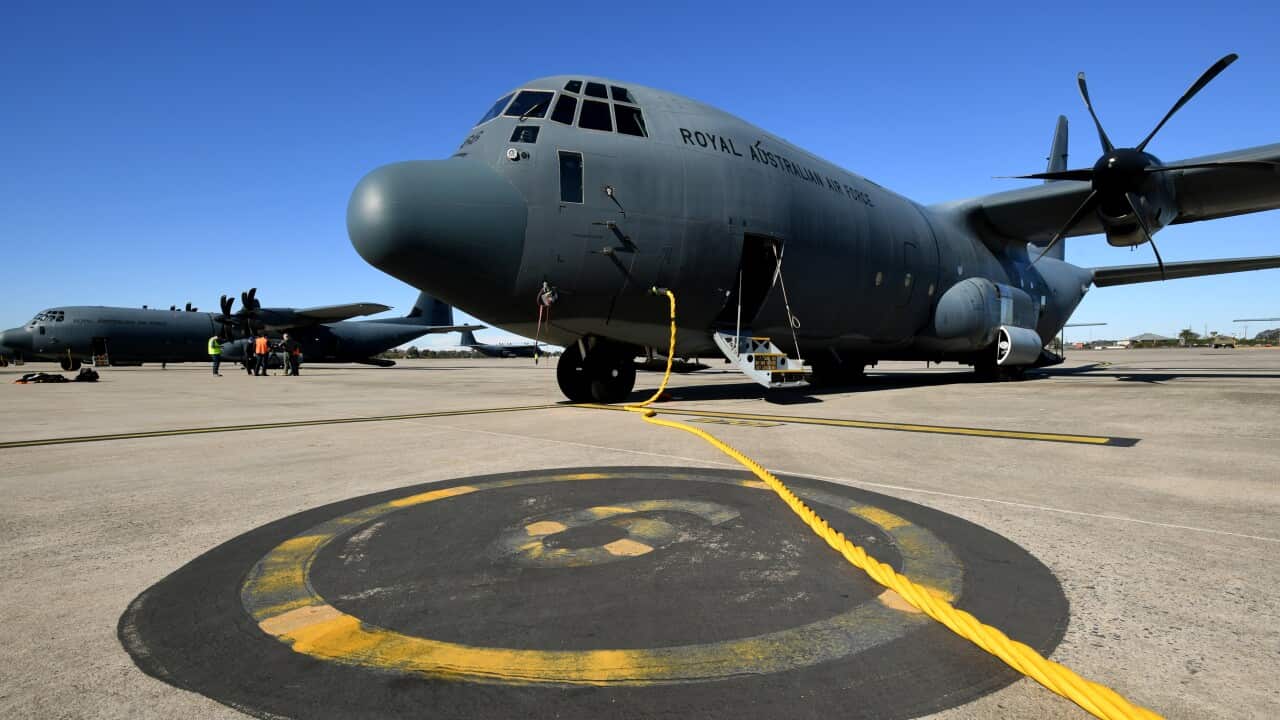 Ground staff prepare Royal Australian Air Force C-130J Hercules aircraft. Defence bosses have warned of the rise of climate refugees. 