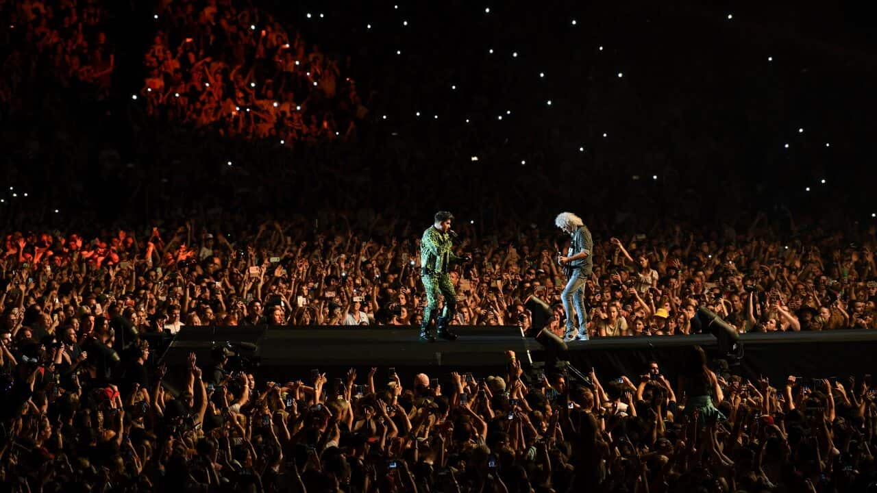 Brian May (right) and Adam Lambert of Queen performs during the Fire Fight Australia bushfire relief concert at ANZ Stadium in Sydney, Sunday, February 16, 2020. (AAP Image/Joel Carrett) NO ARCHIVING