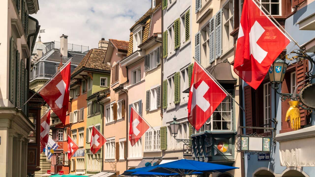 Swiss flags on houses along street