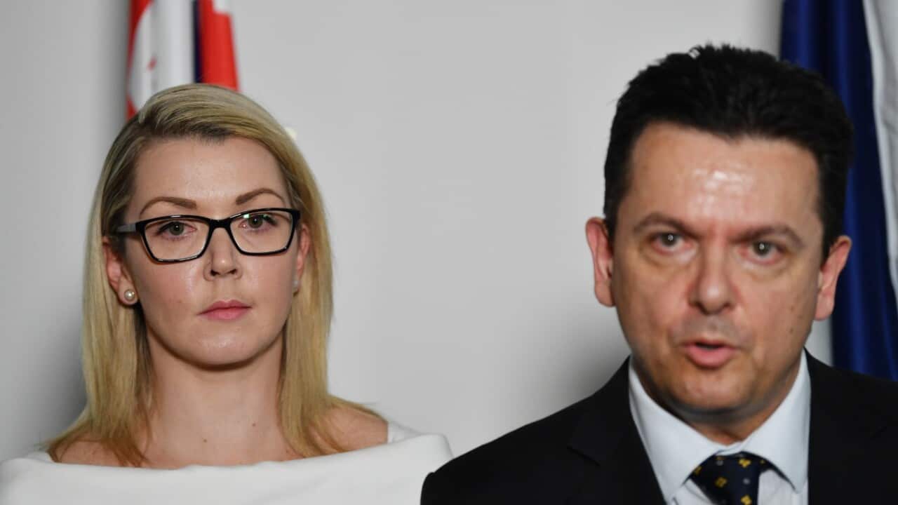 Nick Xenophon Team (NXT) Senator Skye Kakoschke-Moore (left) looks on after announcing her resignation