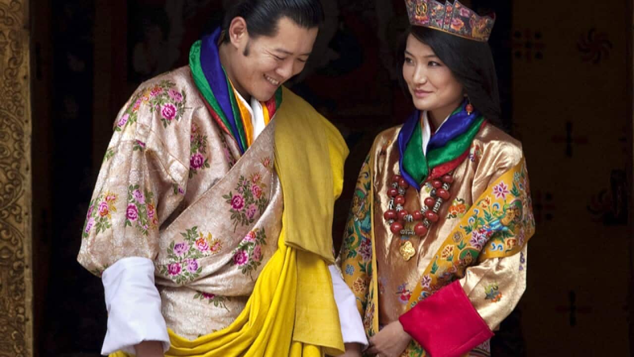 Queen Jetsun Pema, right, looks at King Jigme Khesar Namgyal Wangchuck