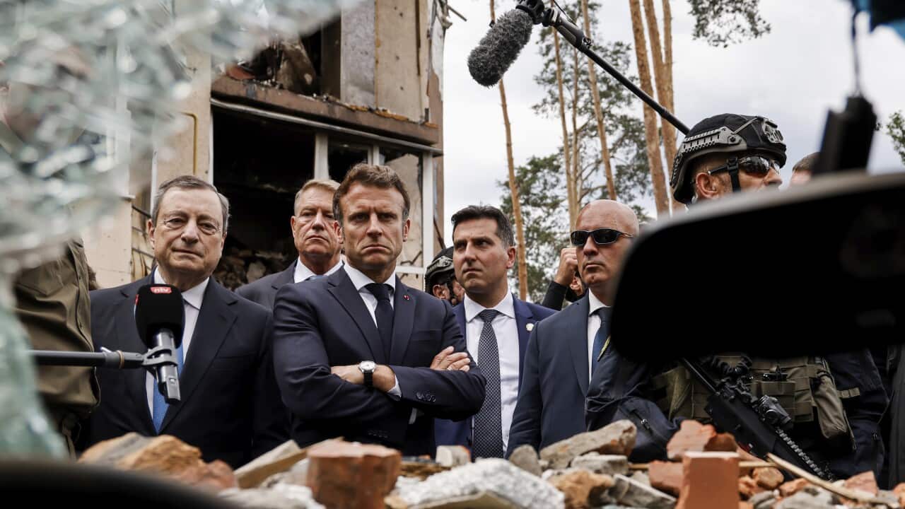 Italian Prime Minister Mario Draghi, left, and French President Emmanuel Macron visit Irpin, outside Kyiv
