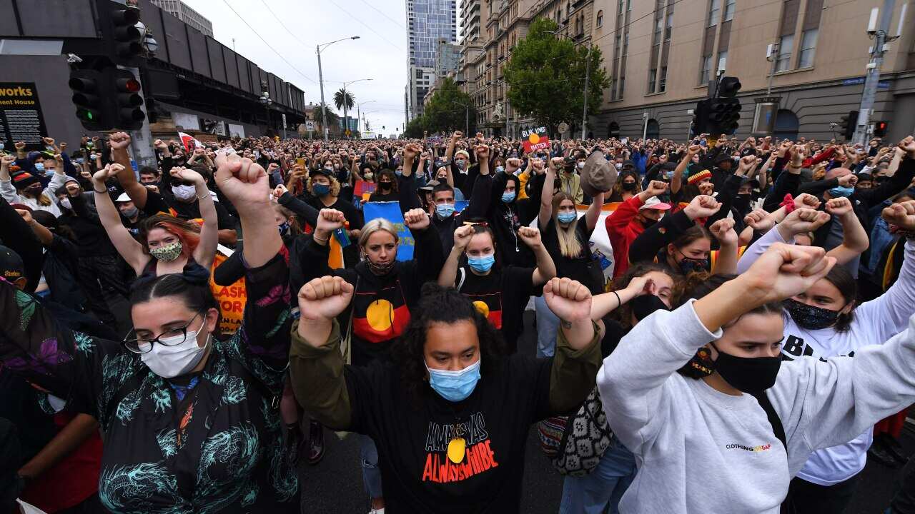 Protesters marched through Melbourne on Tuesday as part of Invasion Day protests.