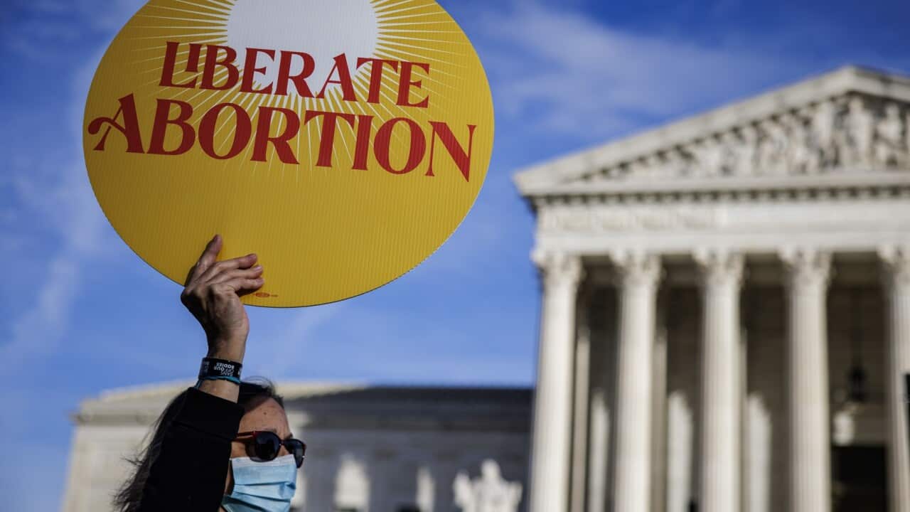 A protestor holds up a sign outside the US Supreme Court