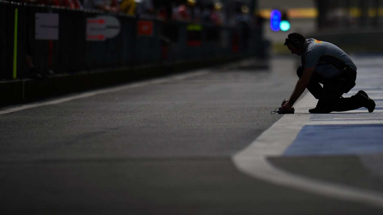 Pirelli tyre technician in the pits