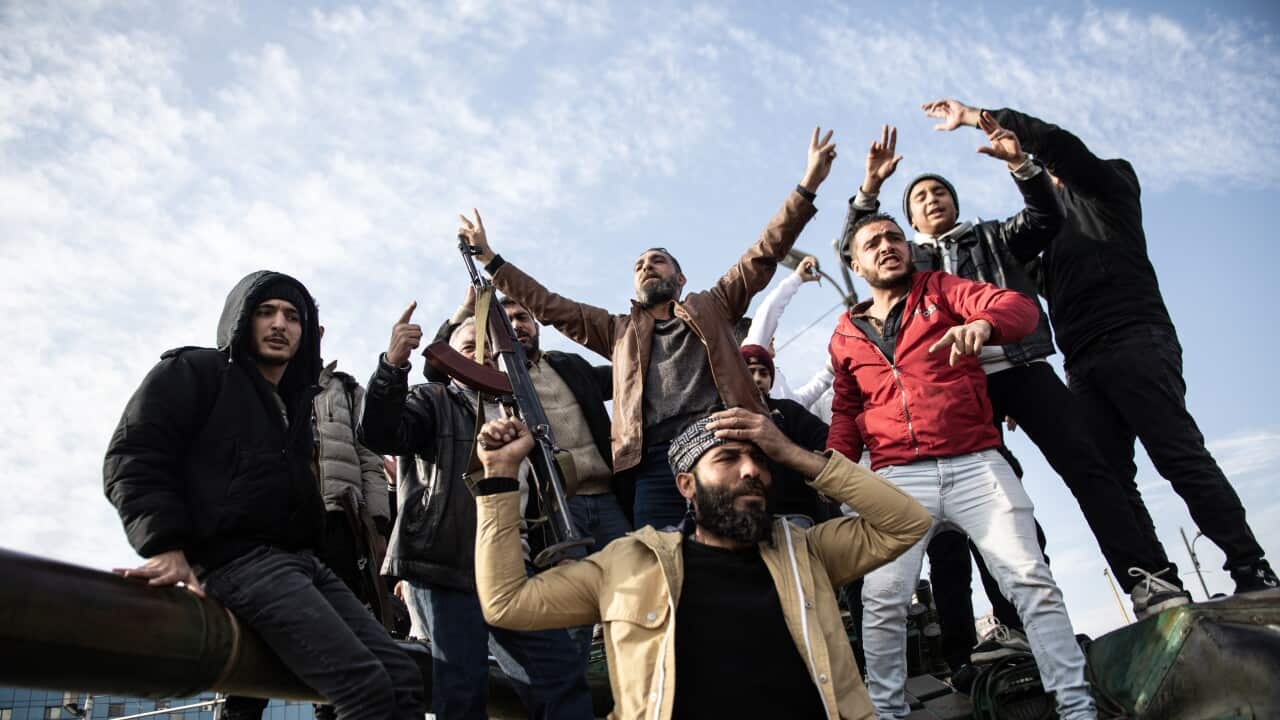 Celebrations in Damascus after rebels capture the city and overthrow al-Assad