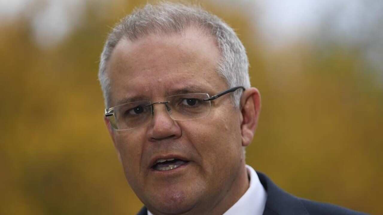 Treasurer Scott Morrison speaks to the media