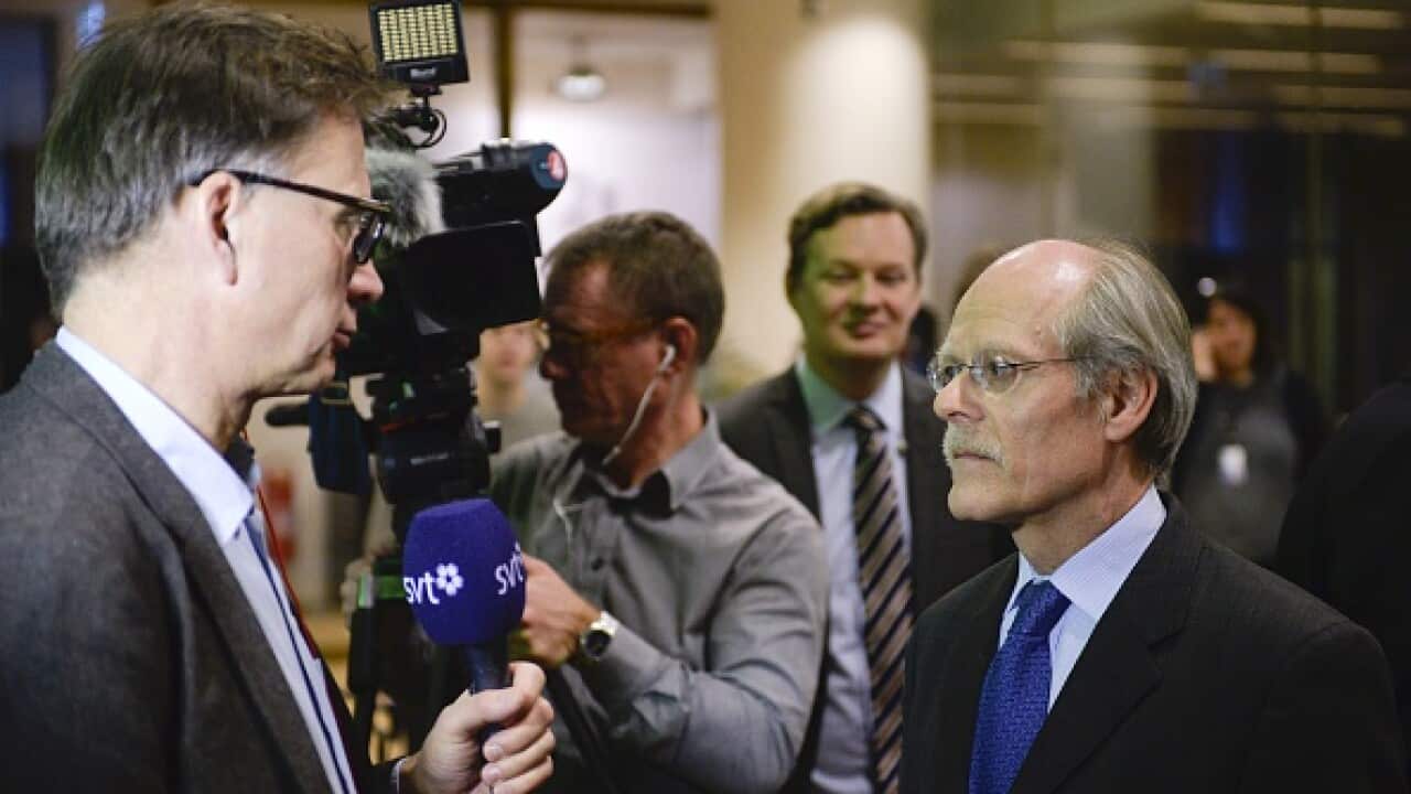 Stefan Ingves, governor of the Swedish central bank Riksbanken (R) talks to journalists after a news conference at the bank's headquarters in Stockholm, Sweden (VILHELM STOKSTAD/AFP/Getty Images)