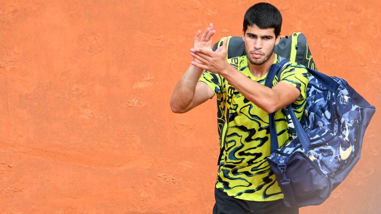 Carlos Alcaraz of Spain waves the crowd after losing his match against Fabian Marozsan of Hungary at the tennis tournament in Rome