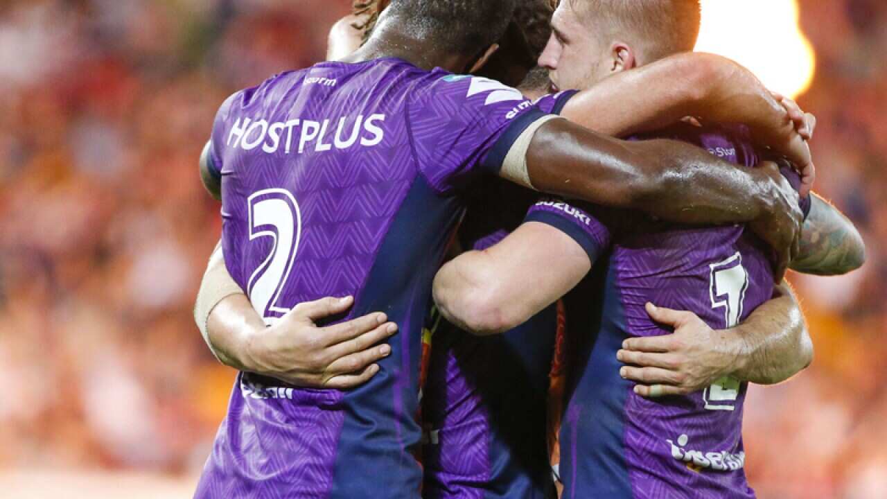 Melbourne Storm players celebrate