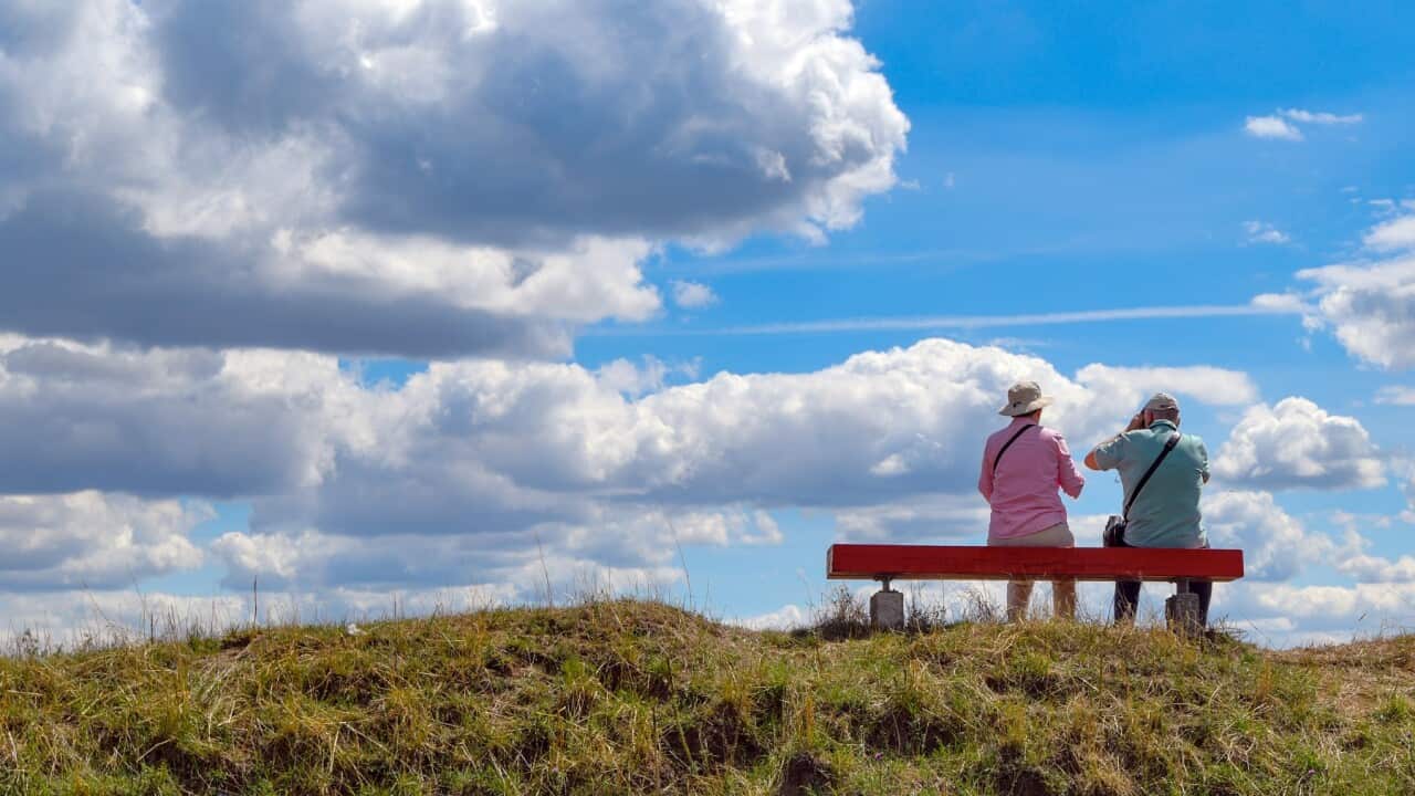 23 July 2020, Brandenburg, Stolpe: Two elderly people are sitting on a bench on a hill in the Lower Oder Valley National Park. Photo: Patrick Pleul/dpa-Zentralbild/ZB (Photo by Patrick Pleul/picture alliance via Getty Images)
