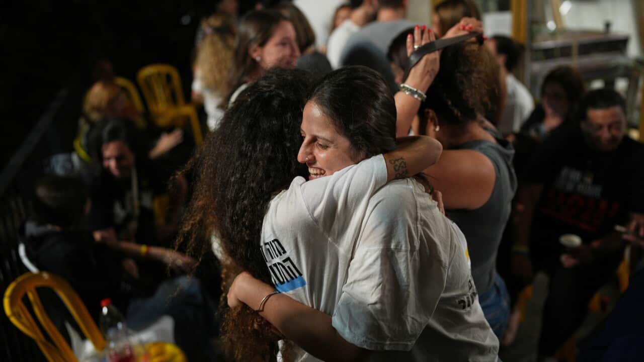 Relatives and supporters of Israeli hostages held by Hamas in the Gaza Strip celebrate after the announcement that Israel and Hamas have agreed to the first phase of a peace plan, as they gather at a plaza known as the hostages square in Tel Aviv, Israel, Thursday, Oct. 9, 2025.