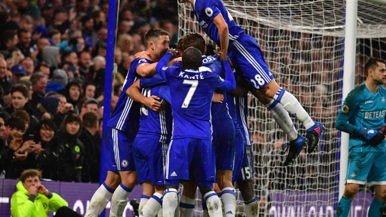 Chelsea's Diego Costa (obscured) celebrates scoring his side