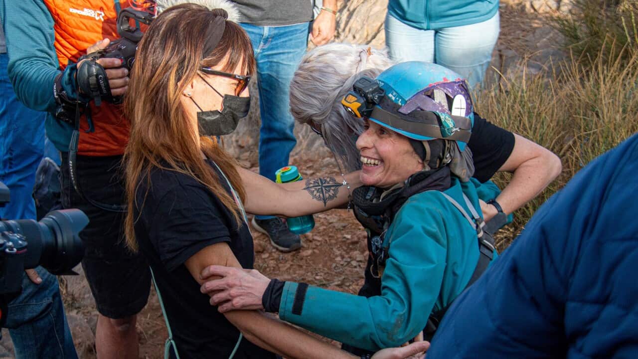 Spanish mountaineer and climber Beatriz Flamini (right) emerges into the sunlight after spending 500 days in a cave as part of an endurance experiment