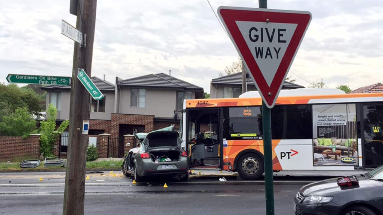 An unmarked police car crashed into a bus