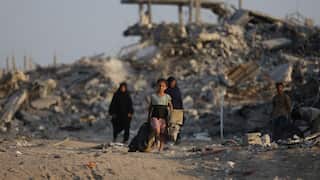A child walking through the ruins of Gaza