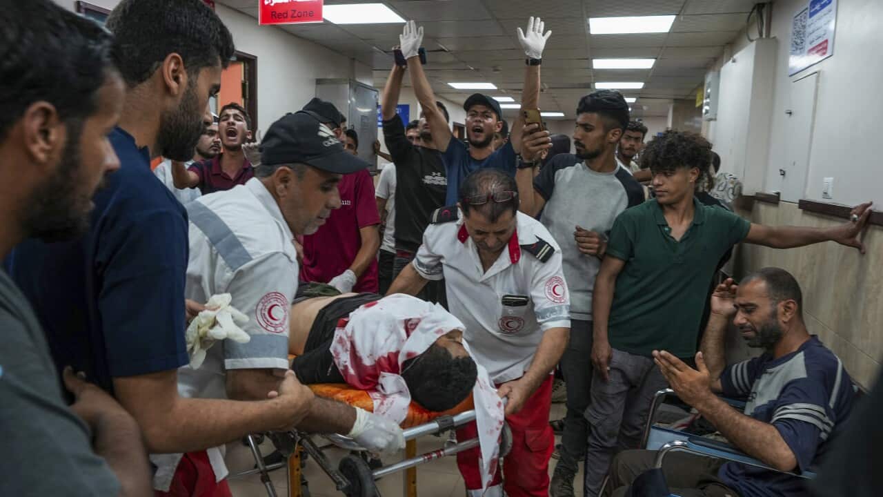 Palestinians wounded in the Israeli bombardment of the Gaza Strip are brought to Al Aqsa hospital (AAP)