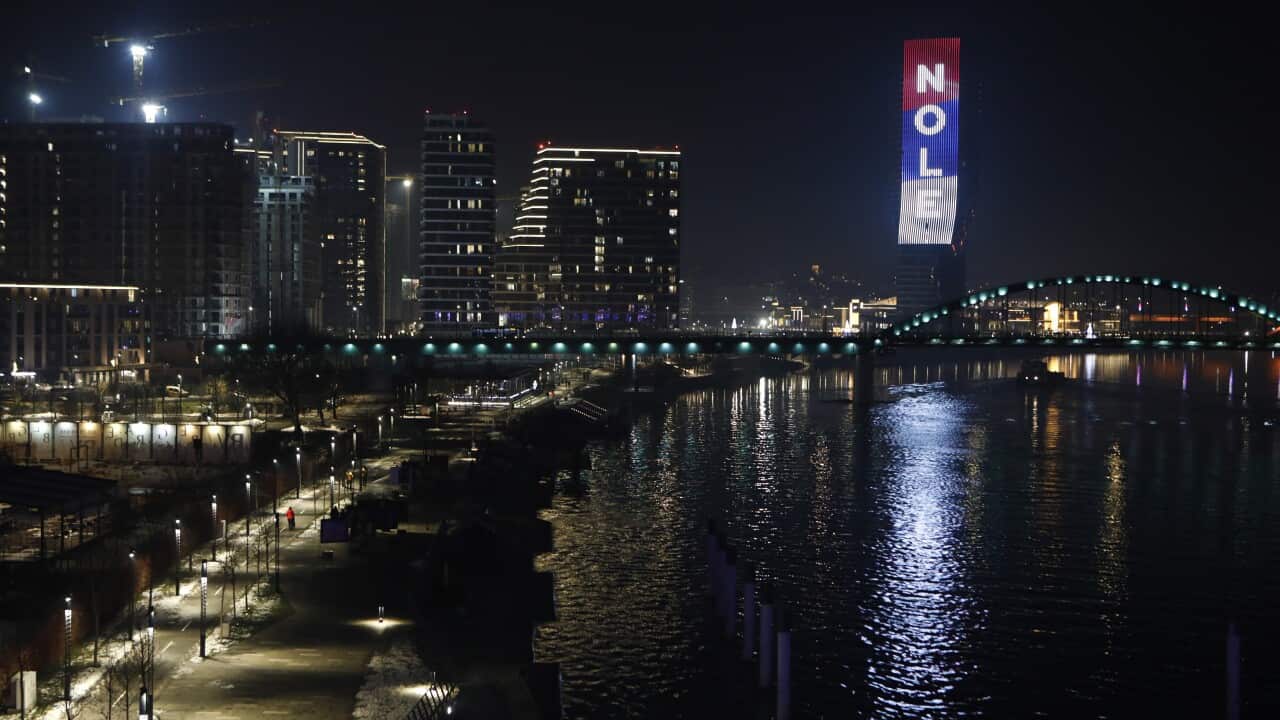 The word 'Nole', nickname of Serbian tennis player Novak Djokovic, and the colors of the Serbian flag are illuminated at the Belgrade Tower in Belgrade, Serbia, late 16 January 2022. Defending champion Novak Djokovic lost his court appeal agai