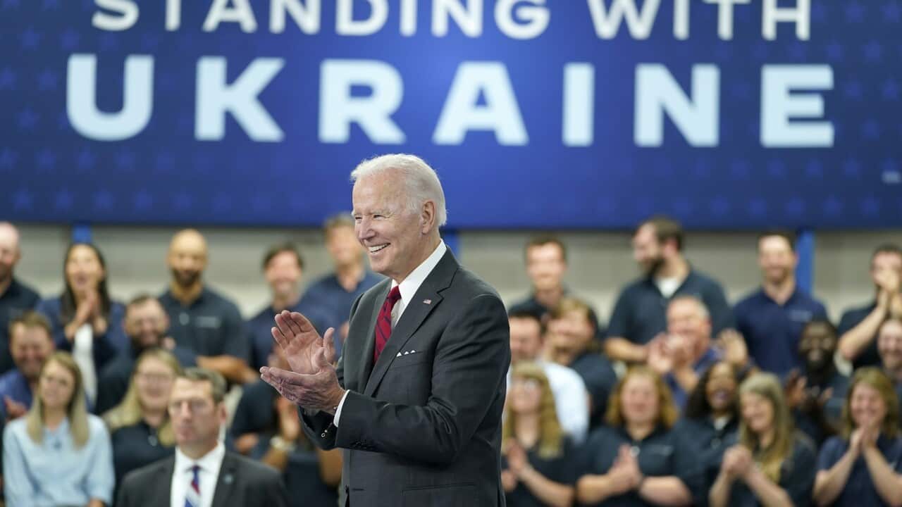 President Joe Biden smiles before speaking on security assistance to Ukraine