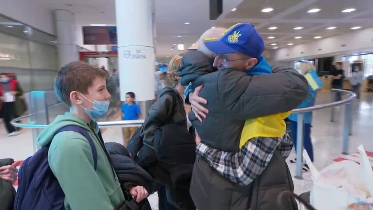 Alex Soroka greets his family who have arrived from Ukraine.