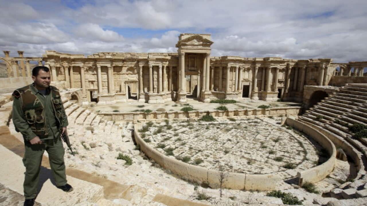 Syrian policeman patrolling the ancient city in March, before IS siezed control (AFP/Getty Images)
