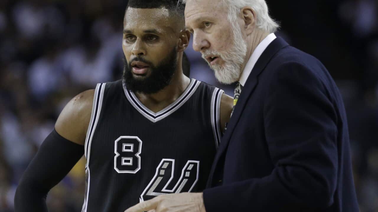 Australian point guard Patty Mills (L)