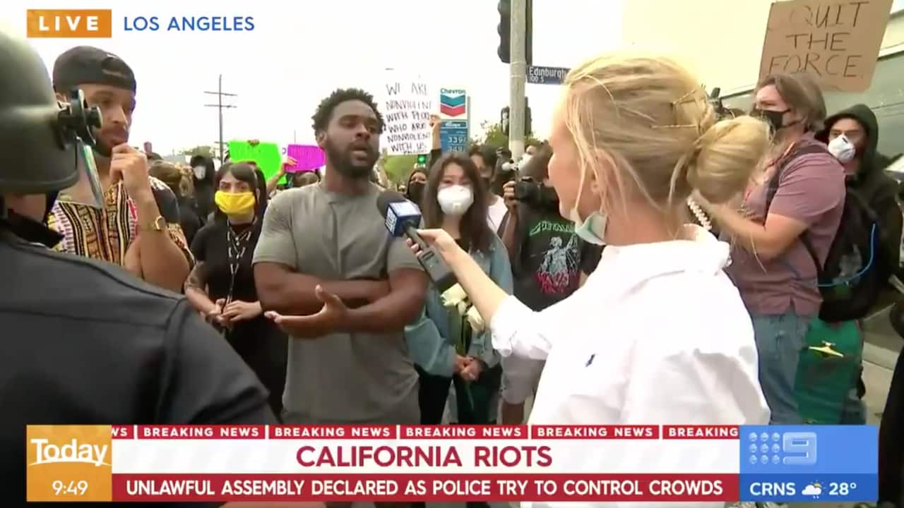 Channel Nine's US Correspondent, Alexis Daish interviews an African American man on the frontline of a protest in Los Angeles.