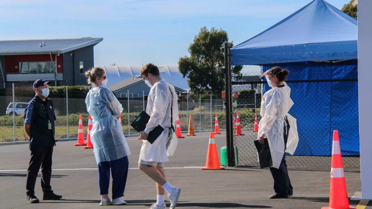 Staff members at a COVID-19 testing station in Christchurch.